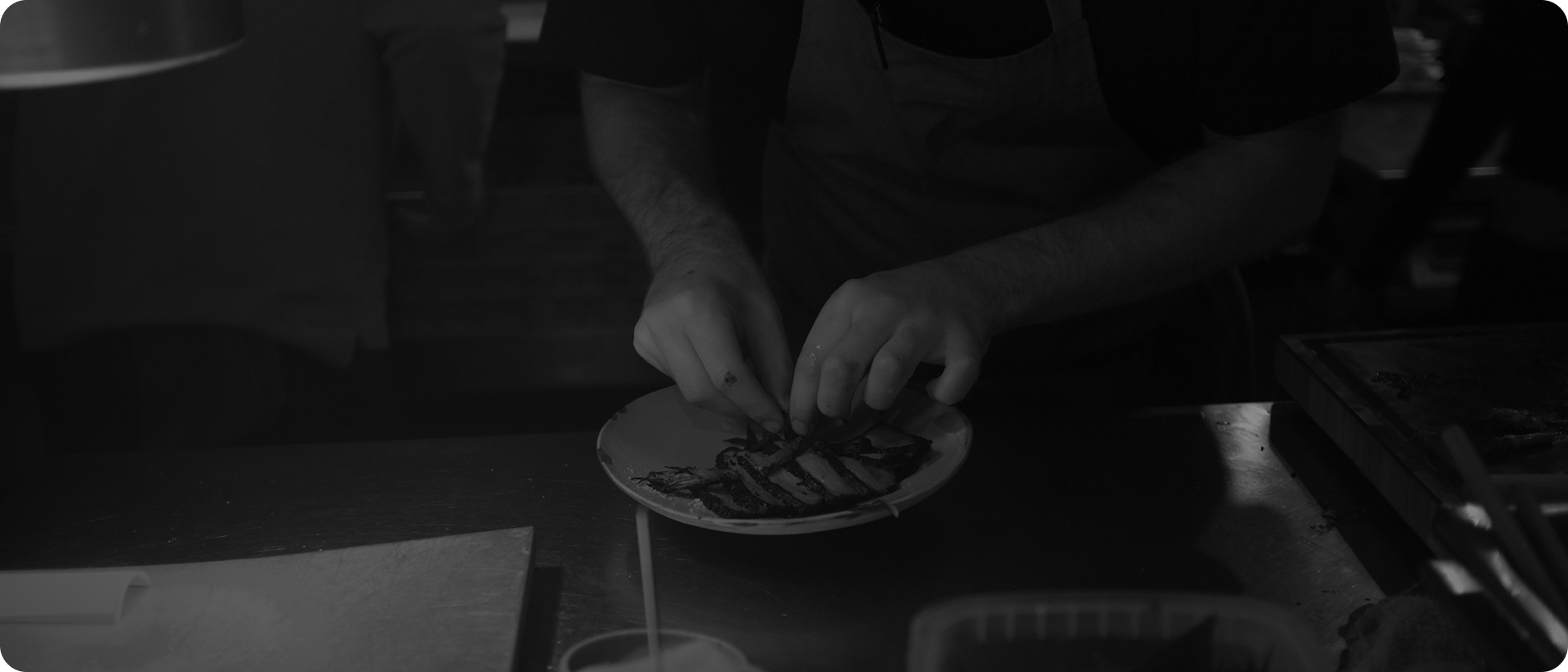 Chef plating a dish at Kitchen King